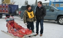 Trent Wotherspoon speaking with a dogsled racer